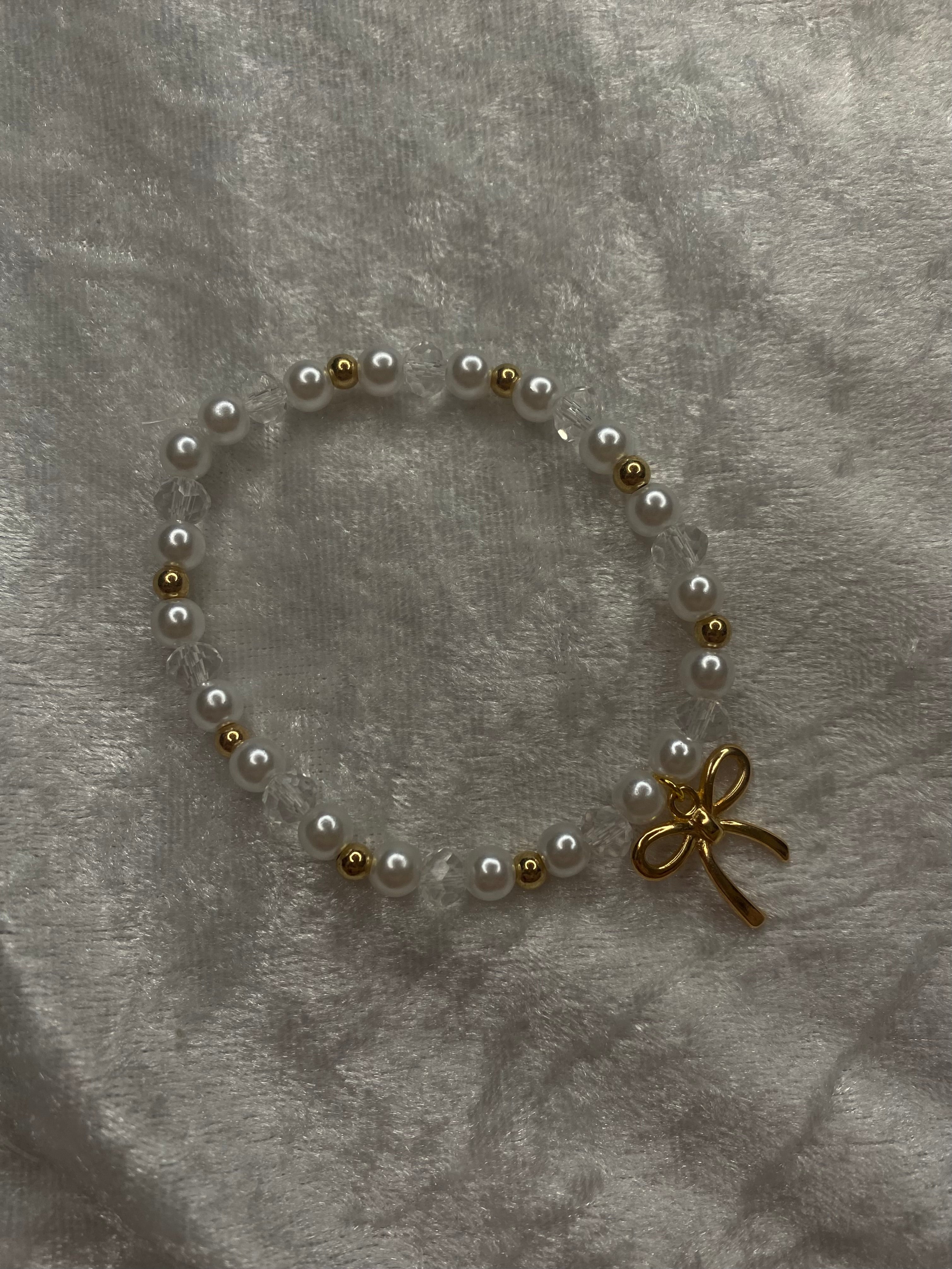 Love Letter white pearl and gold bead bracelet with gold bow charm
